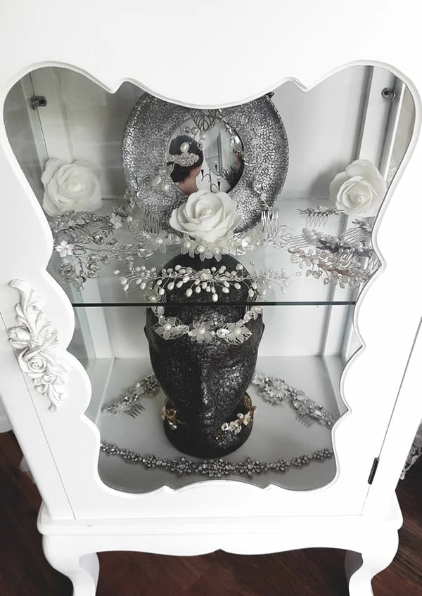Handmade bridal headdresses in display cabinet